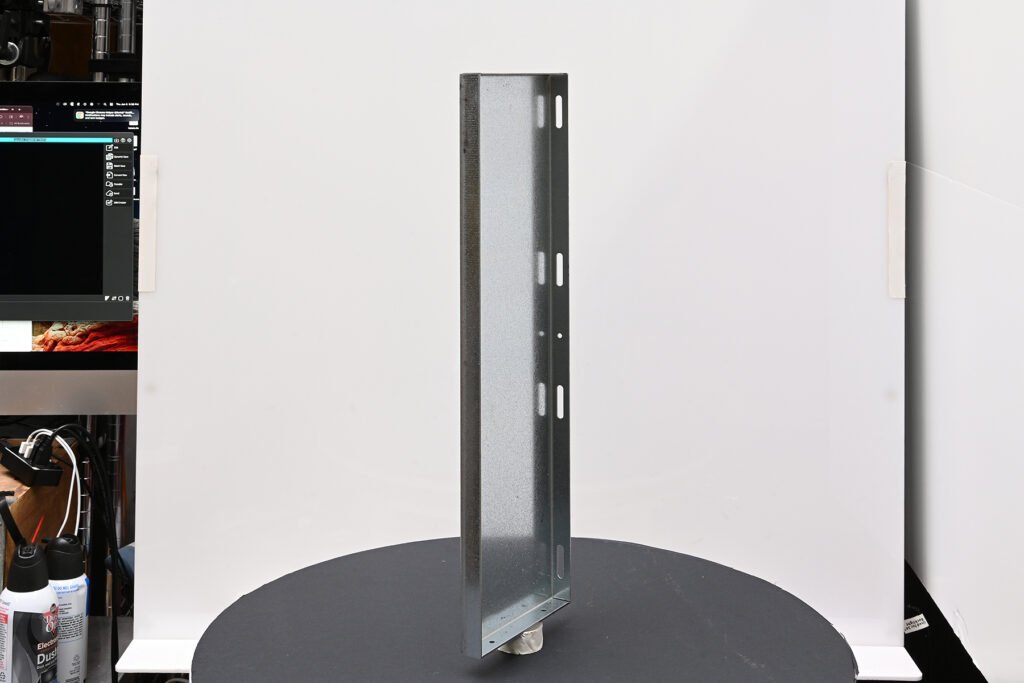 Industrial metal component positioned on a turntable during pre-production setup for 360 degree product photography