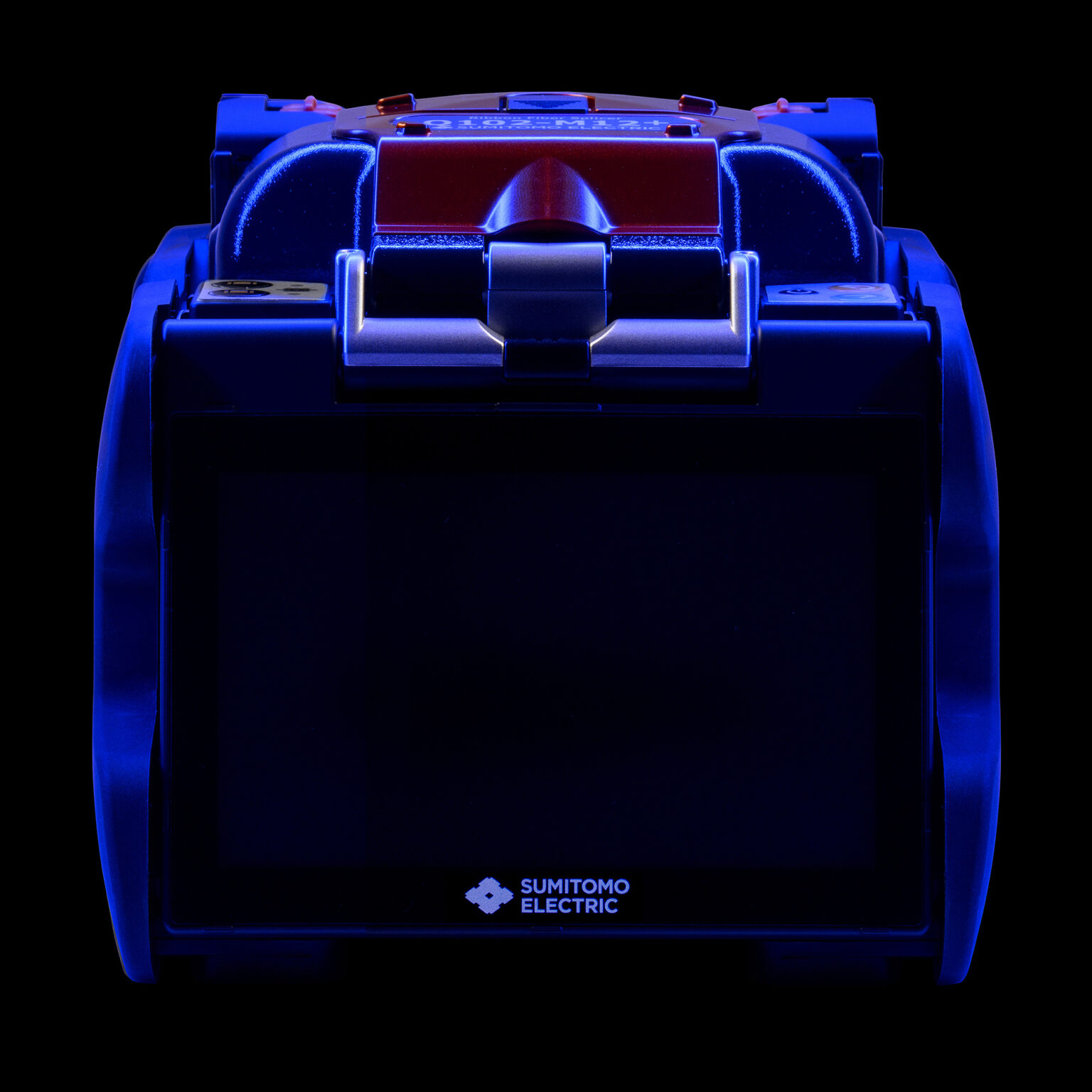 Industrial fiber splicer photographed with controlled studio lighting on black background