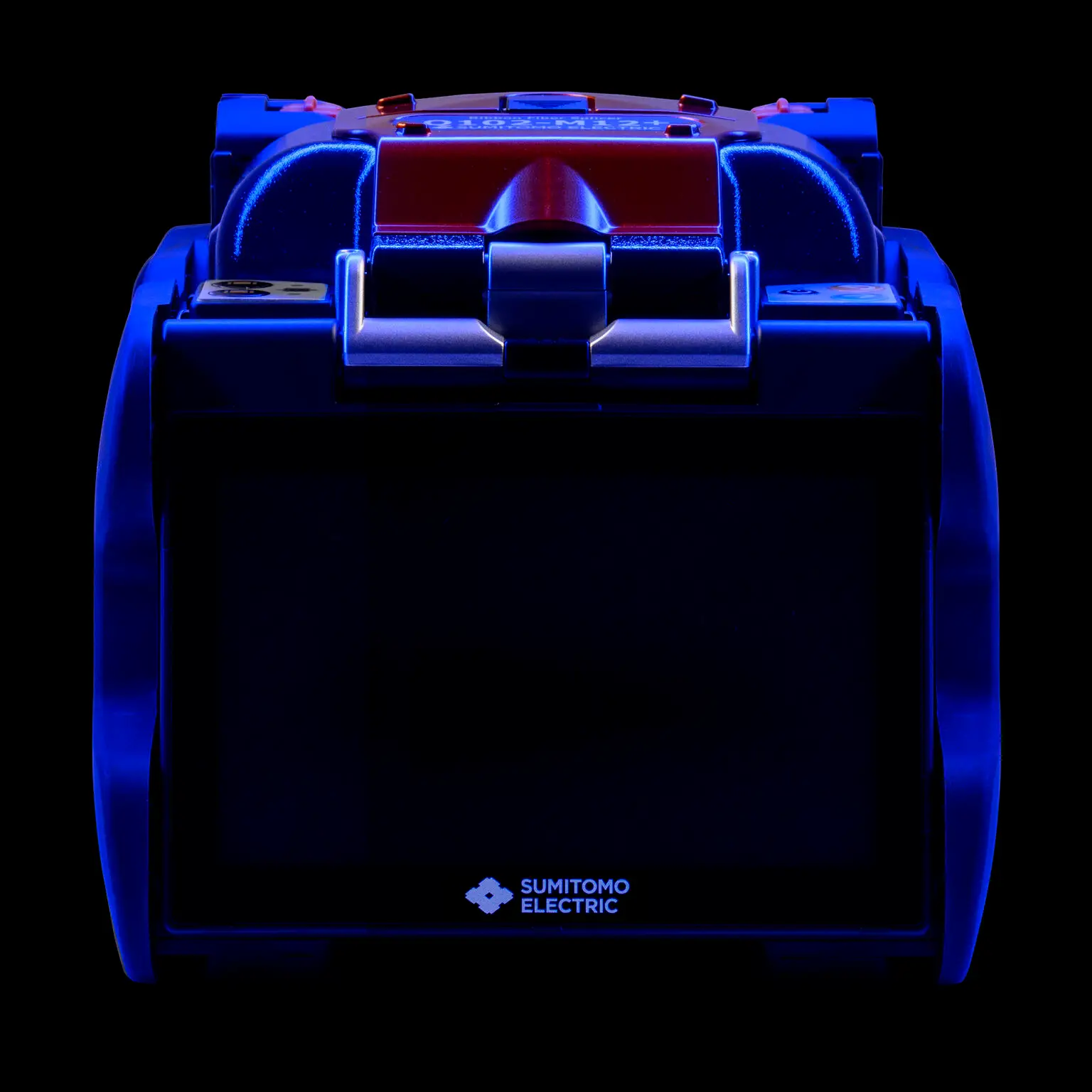 Industrial fiber splicer photographed with controlled studio lighting on black background