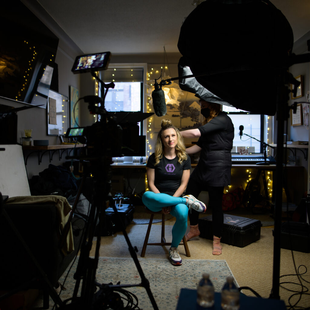 Behind the scenes commercial photography shoot with photographer capturing subject on location.
