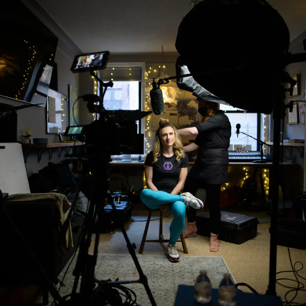 Behind the scenes commercial photography shoot with photographer capturing subject on location.